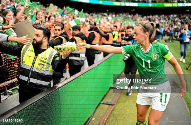 Dublin , Ireland - 23 September 2023; Katie McCabe of Republic of Ireland gives her boots to a supporter after her side's victory in the UEFA Women's...