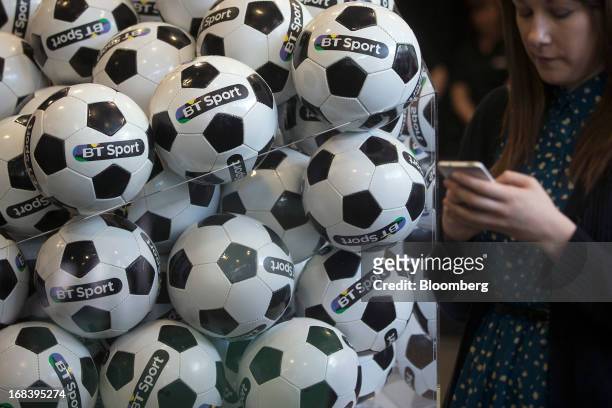 Branded soccer balls sit on display during the launch of BT Group Plc's new sports television channel BT Sport, at the company's offices in London,...