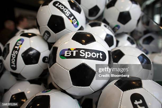 Branded soccer balls sit on display during the launch of BT Group Plc's new sports television channel BT Sport, at the company's offices in London,...