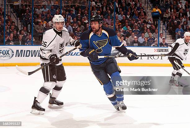 Chris Porter of the St. Louis Blues skates against Slava Voynov of the Los Angeles Kings in Game Five of the Western Conference Quarterfinals during...
