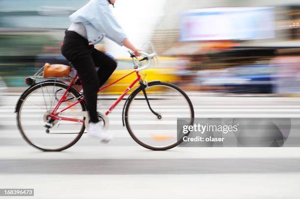 bicycle in motion on zebra crossing - förare yrke bildbanksfoton och bilder