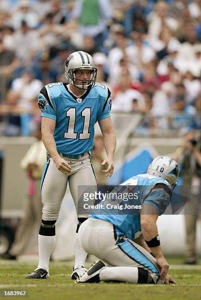 Kicker Shayne Graham of the Carolina Panthers gets set to kick the ball with the help of punter Todd Sauerbrun against the Tampa Bay Buccaneers...