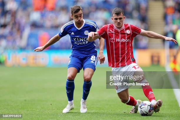 Harry Winks of Leicester City in action with Jason Knight of Bristol City during the Sky Bet Championship match between Leicester City and Bristol...