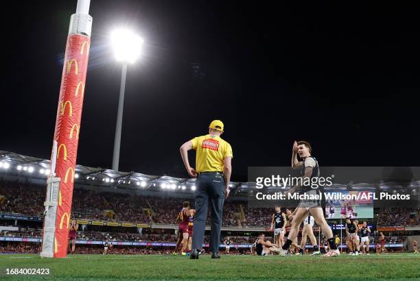 Blake Acres of the Blues gestures to the goal umpire during the 2023 AFL Second Preliminary Final match between the Brisbane Lions and the Carlton...