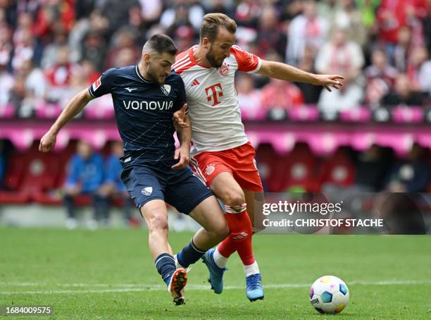 Bochum's Slovak midfielder Matus Bero and Bayern Munich's English forward Harry Kane vie for the ball during the German first division Bundesliga...