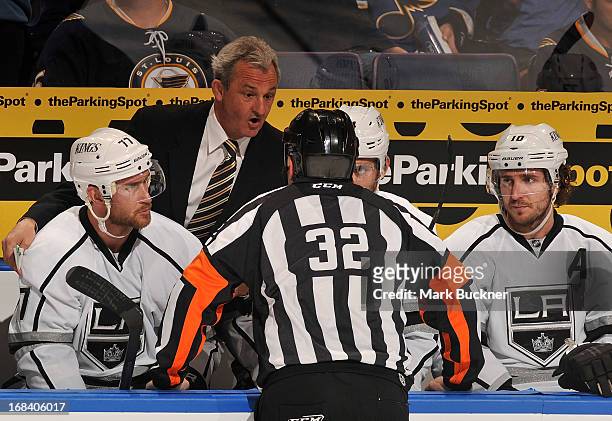 Darryl Sutter of the Los Angeles Kings talks with referee Tom Kowal in Game Five of the Western Conference Quarterfinals against the St. Louis Blues...