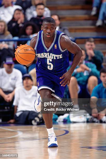 Anthony Goldwire of the Charlotte Hornets dribbles the ball against the Sacramento Kings during a game played on January 12, 1997 at Arco Arena in...