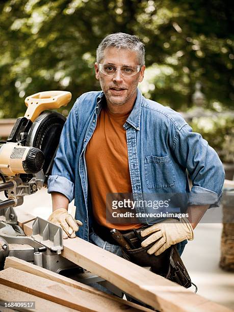 portrait of construction worker - leather glove stockfoto's en -beelden