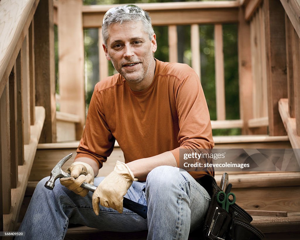 Portrait of Construction Worker Holding Hammer