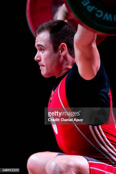 Philipp Forster of Austria B competes in Men's 94kg snatch during day six of the 2013 Junior Weightlifting World Championship at Maria Angola...