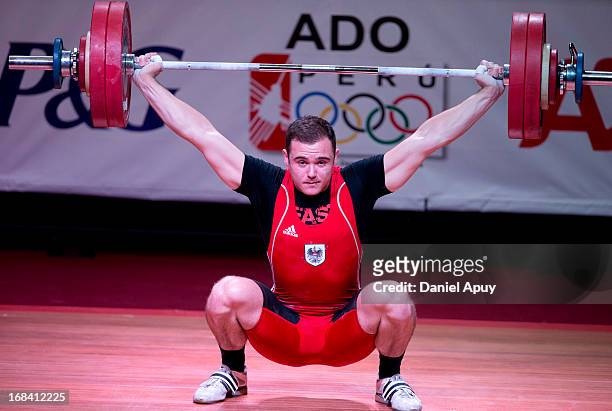Philipp Forster of Austria B competes in Men's 94kg snatch during day six of the 2013 Junior Weightlifting World Championship at Maria Angola...