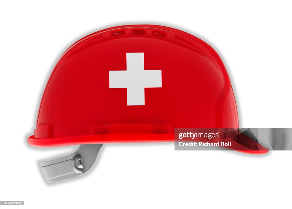 A hard hat with the design of a Swiss flag