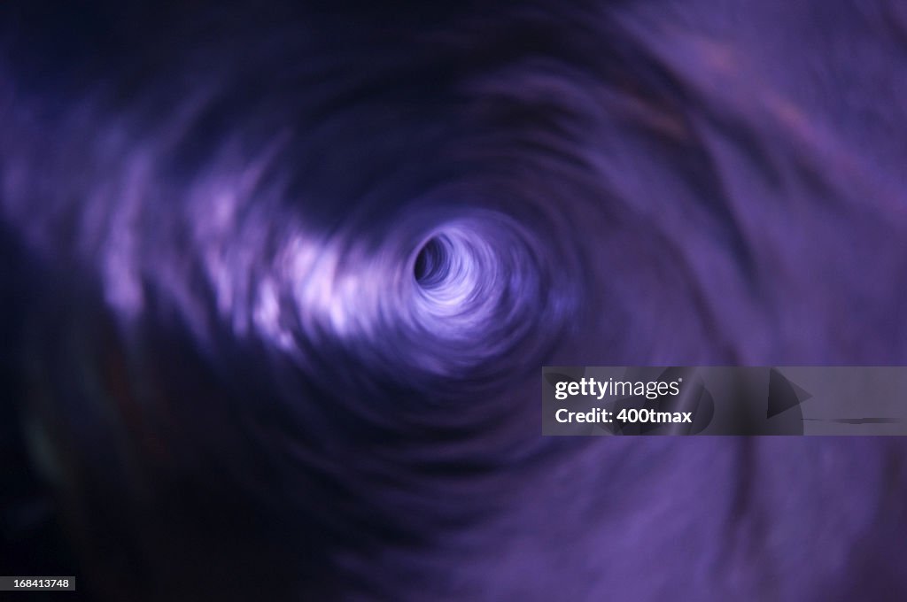 High Resolution Vortex Illuminated Purple Water Vortex High-Res Stock Photo - Getty Images