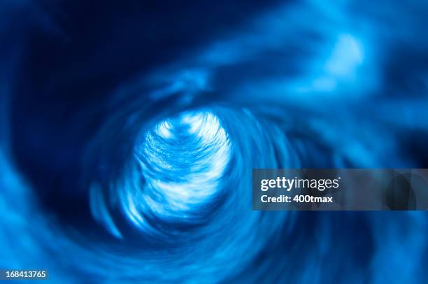 swirling blue water vortex - flushing stock pictures, royalty-free photos & images