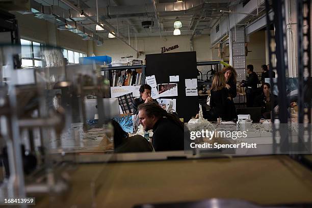 People work at "New Lab", an advanced manufacturing hub in the Brooklyn Navy Yard on May 9, 2013 in New York City. New Lab, where engineers,...