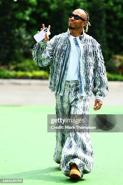 Lewis Hamilton of Great Britain and Mercedes walks in the Paddock prior to final practice ahead of the F1 Grand Prix of Singapore at Marina Bay...