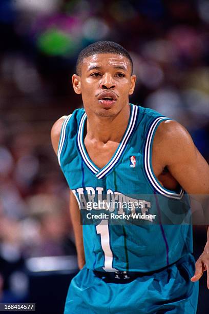 Muggsy Bogues of the Charlotte Hornets looks on against the Sacramento Kings during a game played on February 27, 1991 at Arco Arena in Sacramento,...