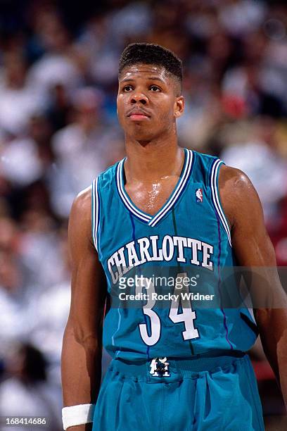 Reid of the Charlotte Hornets looks on against the Sacramento Kings during a game played on February 27, 1991 at Arco Arena in Sacramento,...