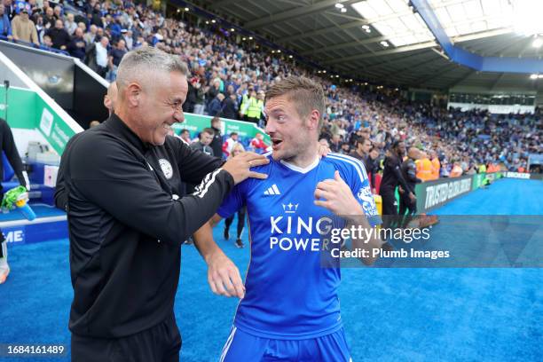 Jamie Vardy of Leicester City and Marcos Alvares Leicester City First team Fitness Coach celebrate after the Sky Bet Championship match between...