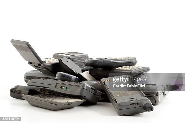 pile of dusty old mobile phones - fabio filzi stock pictures, royalty-free photos & images