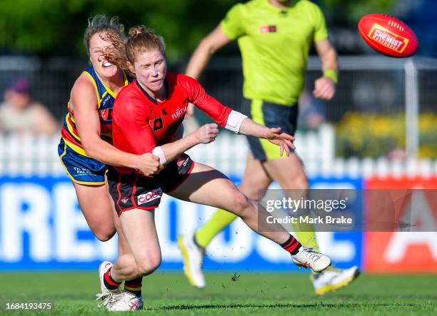 Georgia Nanscawen of the Bombers tackled by Abbie Ballard of the Crowsduring the round three AFLW match between Adelaide Crows and Essendon Bombers...
