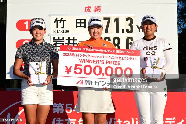 Winner Rio Takeda of Japan poses with runner-up Chisato Iwai of Japan and third place Reika Arakawa of Japan after the longest drive contest...