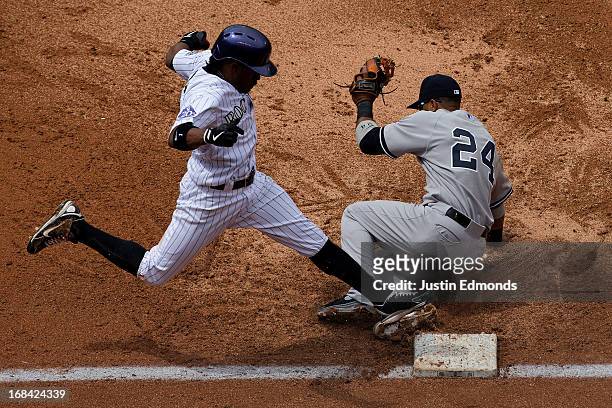 Second baseman Robinson Cano of the New York Yankees falls to the ground but is able to make the catch for an out on a bunt attempt by Eric Young Jr....