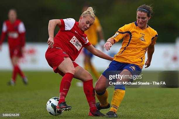 Alex Windell of Bristol Academy FC tracked by Emma Thomson of Doncaster Belles Ladies FC during the The FA WSL match between Bristol Academy Women's...