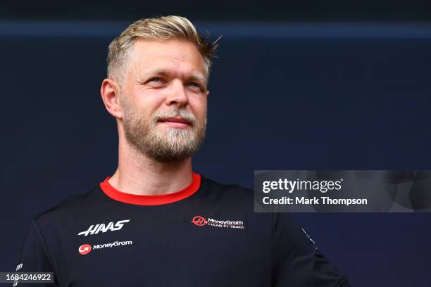 Kevin Magnussen of Denmark and Haas F1 talks to the crowd on the fan stage prior to final practice ahead of the F1 Grand Prix of Singapore at Marina...