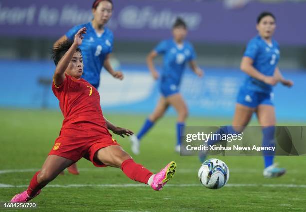 China's Wang Shuang shoots during the women's football group A round match between China and Mongolia at the 19th Asian Games in Hangzhou, east...