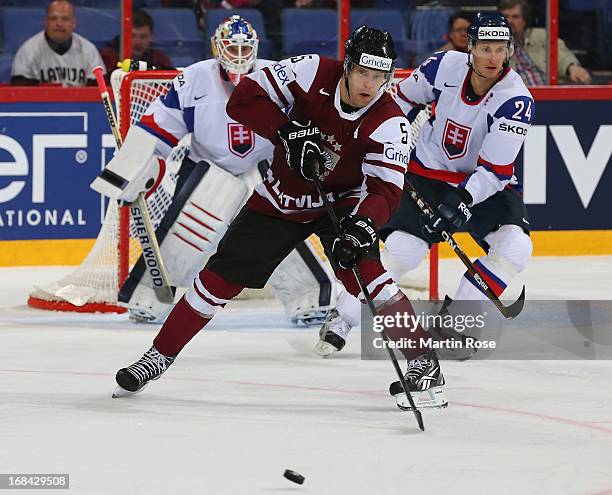 Janis Sprukts of Latvia skates with the puck during the IIHF World Championship group H match between Russia and France at Hartwall Areena on May 9,...