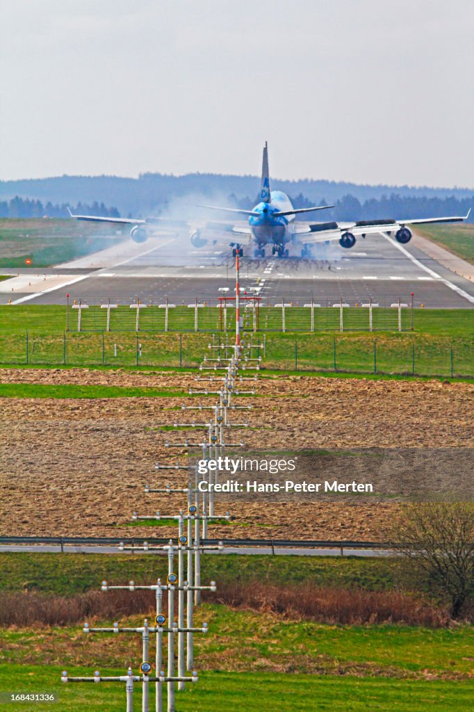 Airport, aircraft landing on runway
