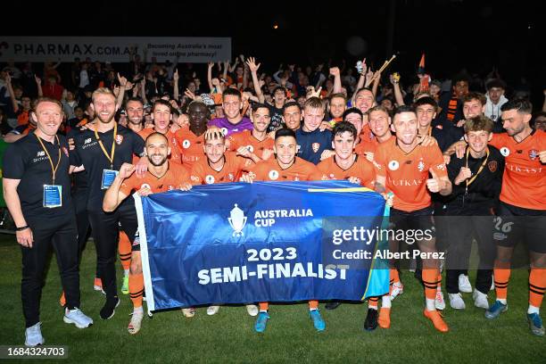 Brisbane Roar players pose for a photo after their victory during the Australia Cup 2023 Quarter Final match between Brisbane Roar and Western Sydney...