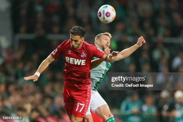 Leart Pacarada of 1. FC Koeln and Mitchell Weiser of SV Werder Bremen battle for the ball during the Bundesliga match between SV Werder Bremen and 1....