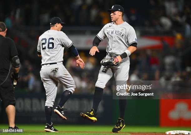 LeMahieu and Aaron Judge of the New York Yankees celebrate after the final out during the game between the New York Yankees and the Pittsburgh...