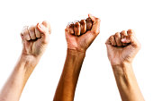 Three clenched female fists triumphantly supporting women's rights