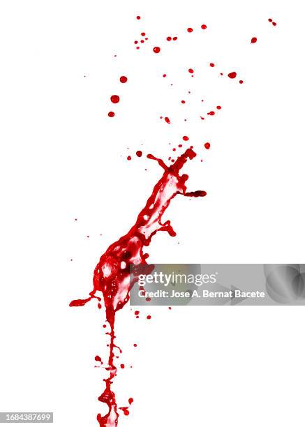 blood spurts and splashes in motion on a white background. - blood stained stock pictures, royalty-free photos & images