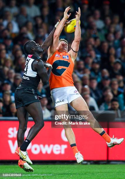 Aliir Aliir of Port Adelaide spoils Jesse Hogan of the Giants during the AFL Second Semi Final match between Port Adelaide Power and Greater Western...