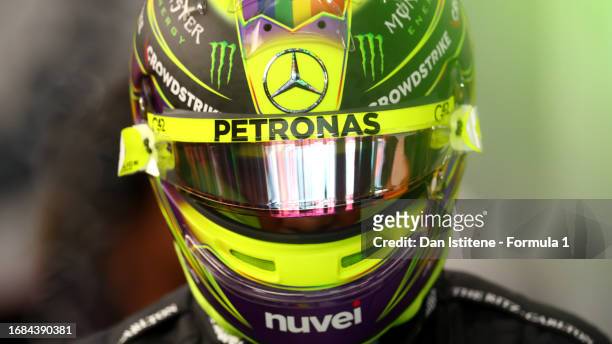 Lewis Hamilton of Great Britain and Mercedes prepares to drive in the garage during final practice ahead of the F1 Grand Prix of Singapore at Marina...