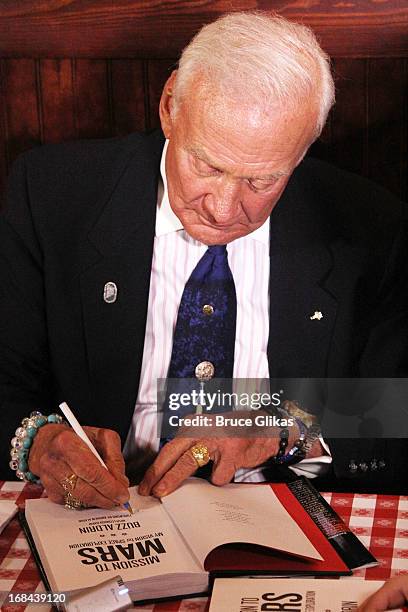 Astronaut Buzz Aldrin promotes his book "Mission to Mars: My Vision for Space Exploration" at Buca di Beppo Times Square on May 9, 2013 in New York...