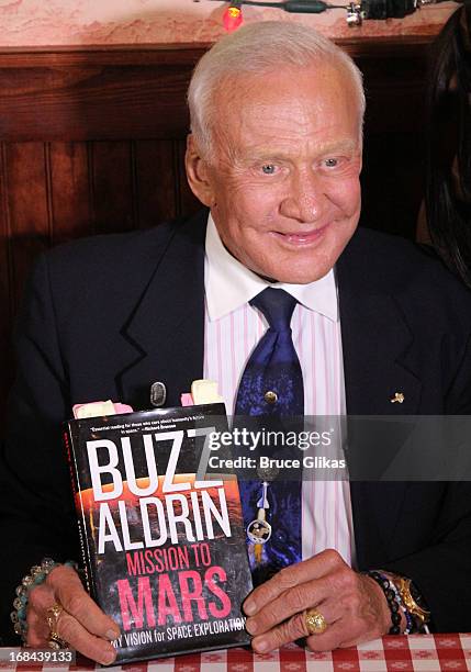 Astronaut Buzz Aldrin promotes his book "Mission to Mars: My Vision for Space Exploration" at Buca di Beppo Times Square on May 9, 2013 in New York...