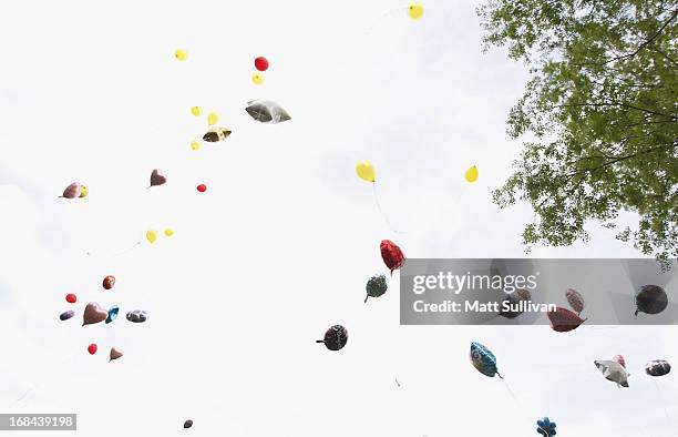 Neighborhood residents where three girls were held captive release ballons during a vigil on May 9, 2013 in Cleveland, Ohio. Ariel Castro was...