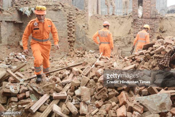 Personnel carry out rescue operations after a two-storeyed building collapse in Loni's Roop Nagar on September 23, 2023 in Ghaziabad, India.