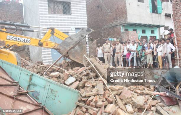 Personnel carry out rescue operations after a two-storeyed building collapse in Loni's Roop Nagar on September 23, 2023 in Ghaziabad, India.