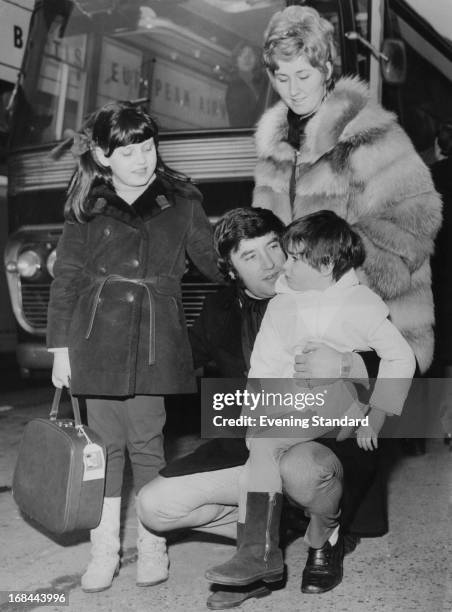 English comedian Jimmy Tarbuck with his wife Pauline and their daughters, Cheryl and Lisa, at London Airport before a holiday flight, 22nd February...