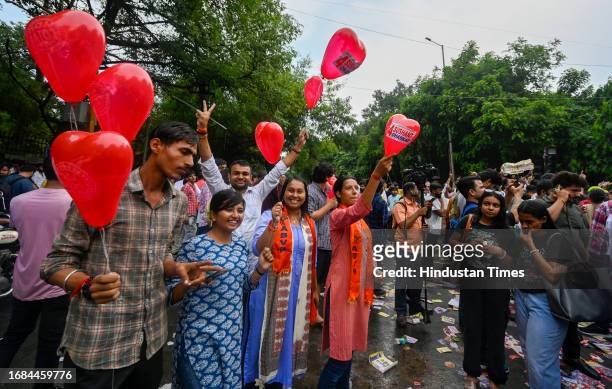 Supporters celebrating after winning all the three posts in the Delhi University Students Union elections, at Delhi University north campus on...