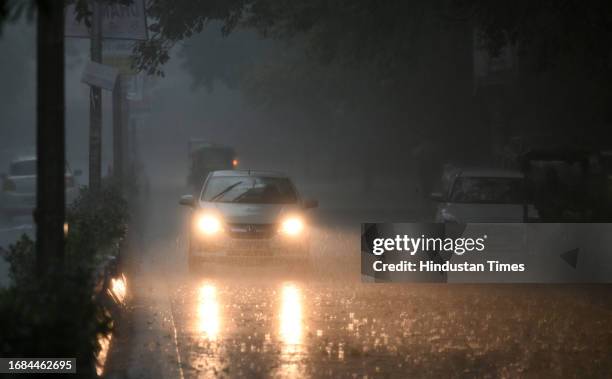 Commuters seen out during the heavy rain at Delhi University Campus, on September 23, 2023 in New Delhi, India.