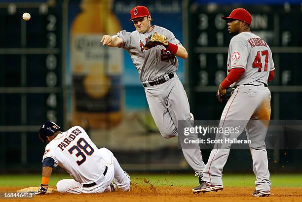 Brendan Harris of the Los Angeles Angels of Anaheim makes a force out at second base on Jimmy Paredes of the Houston Astros in the seventh inning at...