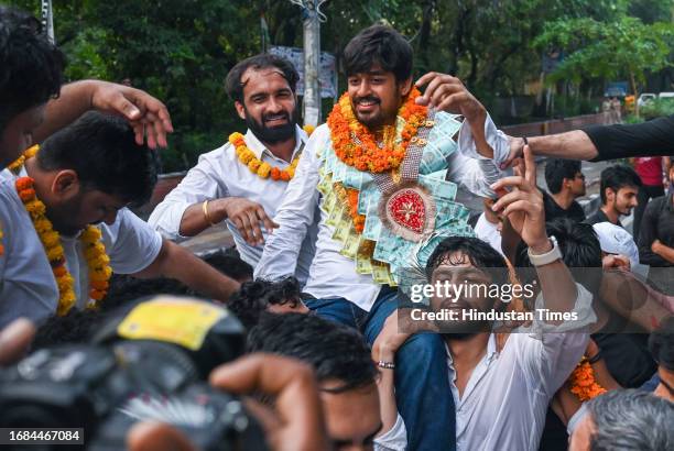 Candidate Abhi Dhaiya celebrating after winning the posts in the Delhi University Students Union elections, at Delhi University north campus on...