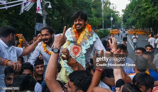 Candidate Abhi Dhaiya celebrating after winning the posts in the Delhi University Students Union elections, at Delhi University north campus on...